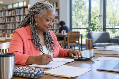 A person reviewing a household loan budget