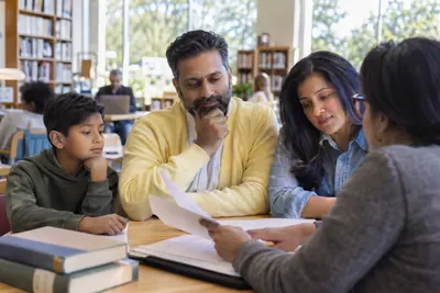 People reviewing household borrowing paperwork