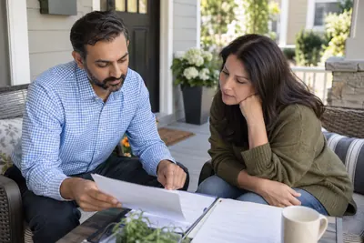 People reviewing home and mortgage paperwork